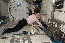 Astronaut Tracy Caldwell Dyson vacuums equipment on the International Space Station. ISS-24 Tracy Caldwell Dyson during housekeeping.jpg