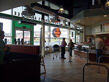 Inside a 'factory' Krispy Kreme located within the Tesco Extra store at North Harbour, Portsmouth, England. Inside A Krispy Kreme Portsmouth.jpg