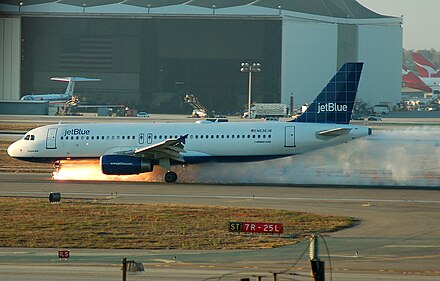 JetBlue Airways Flight 292, an Airbus A320, making an emergency landing on runway 25L at Los Angeles International Airport in 2005 after the front landing gear malfunctioned