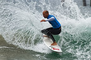 Kelly Slater competing at the 2011 US Open of Surfing in Huntington Beach, California Kelly Slater (6020584199).jpg