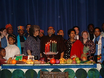 A 2003 Kwanzaa celebration with Kwanzaa founder Maulana Karenga at the center, and others