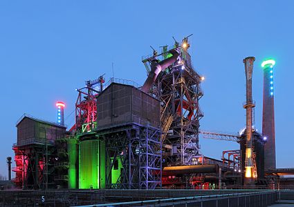 Impression of Landschaftspark Duisburg-Nord at blue hour. Illumination of blast furnace.