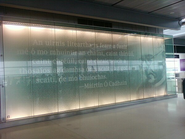 Memorial to Irish language activist and novelist Máirtín Ó Cadhain inside Dublin Airport: "The best literary tool I got from my folks is the language 