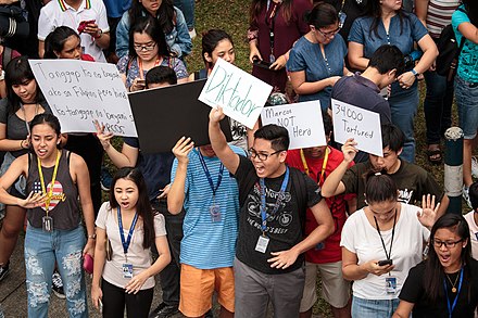 Students of the Ateneo de Manila University along Katipunan Avenue protesting against the burial of Marcos insisting that the former president is not a hero, but a dictator