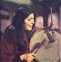 Folk singer Mercedes Sosa playing a bombo leguero, a traditional drum used in chacarera Mercedes Sosa.jpg