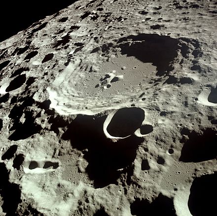 Uncrewed and crewed spacecraft missions have been used to image distant locations within the Solar System, such as this Apollo 11 view of Daedalus crater on the far side of the Moon.