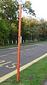 English: The bus stop in Bure Lane, at the junction with Brook Way, in Mudeford, Christchurch. The opposite stop can be seen in the background. It was for limited services run by Wilts & Dorset, however Wilts & Dorset stopped operating the services and so their bus stop flags were taken off. The same stop, a year earlier (with bus stop flags) can be seen here: File:Mudeford Brook Way bus stop.JPG.