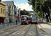 Baru dan lama Muni Metro trains di Duboce dan Gereja, januari 2018.JPG