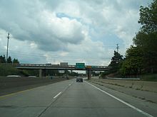 A narrow, older "grandfathered" section of I-94/I-69 after entering Michigan from Sarnia, Ontario. This section has since been reconstructed to modern standards. Older Style Narrow Interstate Highway 94 69.jpg