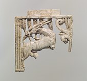 Openwork furniture plaque with a grazing oryx in a forest of fronds; 9th–8th century BC; ivory; 12.7 × 11.91 × 1.09 cm; Metropolitan Museum of Art