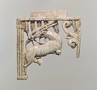 Openwork furniture plaque with a grazing oryx in a forest of fronds; 9th–8th century BC; ivory; 12.7×11.91×1.09 cm; Metropolitan Museum of Art