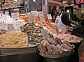 A seafood display bulges out of the open-fronted Pure Food Fish store.