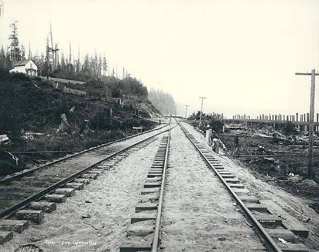 Looking south on the Seattle and Montana Railroad as it passes Port Gardner Bay in 1891
