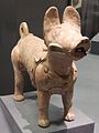 Red pottery funerary figurine of a dog