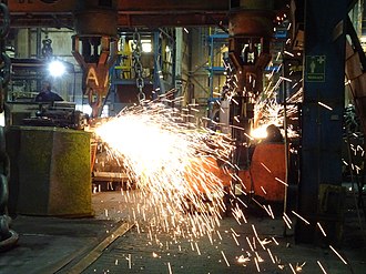 Flash welding and grinding of a new link in the hanging chain in Ramnas, Sweden Ramnas bruk AB 4.jpg