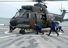 A Republic of Singapore Air Force Super Puma on the flight deck of dock landing ship USS Harpers Ferry during a bilateral maritime exercise in 2007. The Chiefs of the Air Force, Army and Navy are among the office holders whose appointments and dismissals must be concurred in by the president. Republic of Singapore Air Force Eurocopter AS332 Super Puma on the USS Harpers Ferry during CARAT 2007 - 20070723.jpg