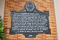 Heritage marker of the Santa Cruz Church located on the right side facade.