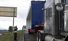 An NTSB investigator examines the truck that struck the bridge. Skagit bridge truck.jpg