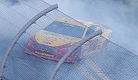 Logano doing burnouts after winning the Daytona 500. Sliced Bread celebrates with doughnuts (cropped).JPG