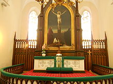 The green furnishings of the high altar are mostly plain velvet, but the main frontal panel is richly embroidered. Similar sets of alternative colours are used at other periods of the church year. St-John-Tallinn-altar.jpg