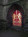 The west door with Lord Shrewsbury's heraldic symbols.