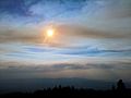 Sun passing through one of several bands of smoke clouds from Wallow, AZ fire. - panoramio.jpg