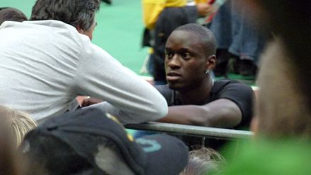 Tamgho in discussion with his coach at the 2009 Meeting Areva.