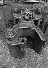 AAR Type "E" coupler as may be serving on some rail car movers in North America. Pulling up on the link at the rear releases the knuckle allowing uncoupling.