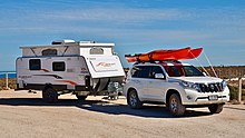 Starcraft fold-down camping trailer, manufactured by Jayco, being pulled by a Toyota Land Cruiser in 2017. Toyota Land Cruiser Prado + Jayco Starcraft, Bunda Cliffs, 2017 (01).jpg