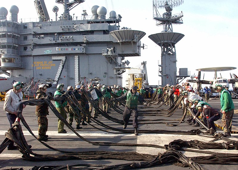 File:US Navy 021208-N-0275F-507 Flight deck Sailors stretch out a barricade during an aircraft mishap drill on the Roosevelt's flight deck.jpg