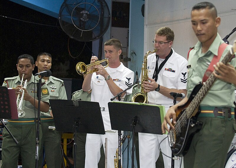 File:US Navy 090626-N-1722M-061 Musician 2nd Class Collin Reichow, center left, and Musician 2nd Class John Wylie, both assigned to the U.S. 7th Fleet Rock Band Orient Express, perform with the Malaysian Armed Forces KOMBO D' Tiger.jpg