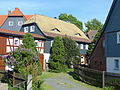 Residential house (surrounding area) with adjoining side building and enclosure