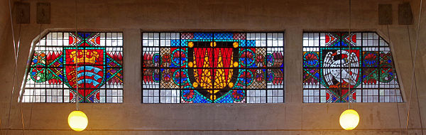 Coats of arms of Middlesex (left) and Buckinghamshire (right) in stained glass at the exit from Uxbridge tube station.