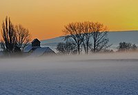 Die Rosenmühle beim Abendnebel und Sonnenuntergang.