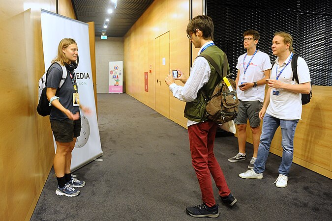 Being interviewed by another Wikimedian in front of the hack-a-thon room.