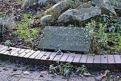 The plaque of a pensive sculpture of St. Peter in a space dubbed 'Thinker's Corner' in Kingston upon Hull.