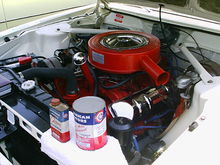 Engine bay of a 1963 AMC Ambassador with a 327 V8 four-barrel 1963 327 V8 engine in Ambassador.jpg