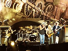 Soundtrack was promoted by the song Big Gun by the group AC/DC (pictured in 2009), which was their first to reach the top of the Billboard charts AC DC Black Ice Tour 2009 Buenos Aires 4 de Diciembre (4237872879).jpg