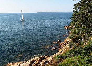 English: a beach in maine on a clear day with ...