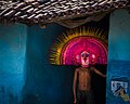 A boy from purulia West Bengal is wearing a lord Ganesha chou mask