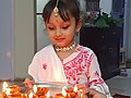 A girl child holding dipak plate in Festival Dipawali