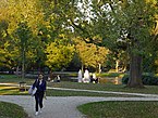 A photo of parks in Amsterdam city, free download; an Autumn view of the pond and fountain in the Westerpark with yellowing trees by Fall. Fons Heijnsbroek, street photography of The Netherlands 2018 in high resolution; free image CC0