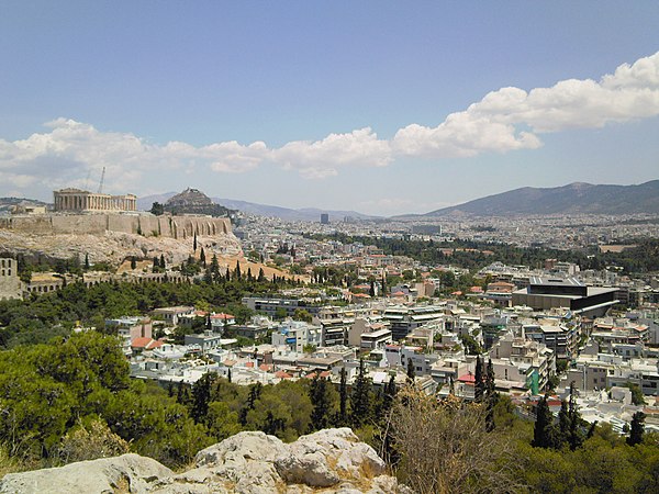 Parthenon (left) and Acropolis Museum (right).