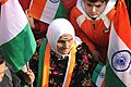 An old lady holding national flag of India