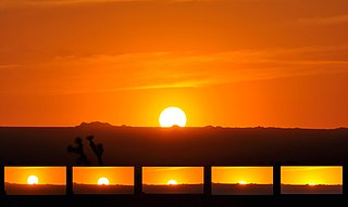 Sunset, also known as sundown, is the daily disappearance of the Sun below the horizon due to Earth's rotation. As viewed from the Equator, the equinox Sun sets exactly due west in both Spring and Autumn. As viewed from the middle latitudes, the local summer sun sets to the southwest for the Northern Hemisphere, and to the northwest for the Southern Hemisphere.