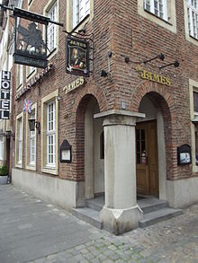 The James, an English-style pub in Munster, sporting the UK flag and the sign of James II Anglophile German Inn.JPG