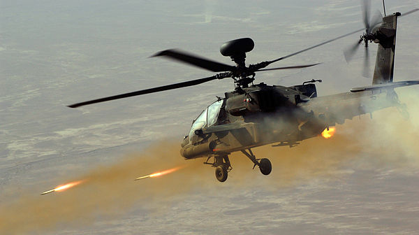 A British AgustaWestland Apache helicopter fires rockets at insurgents in Afghanistan, June 2008.