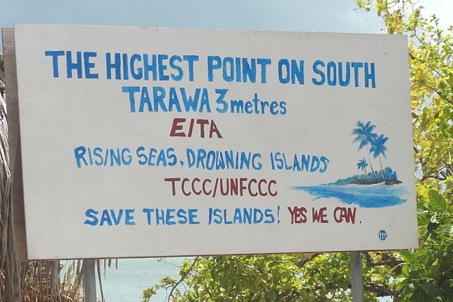 A sign on South Tarawa, Kiribati discussing the threat of sea level rise to the island, with its highest point being only three metres above sea level