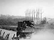 Australian military truck travelling to Hill 63 during an attack on the ANZAC batteries in Messines (AWM E00649)