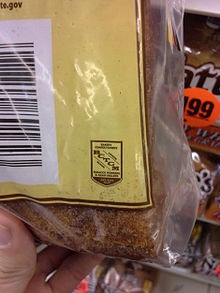 A loaf of bread bearing the union label of the Bakery, Confectionery, Tobacco Workers and Grain Millers' International Union BCTGM Union Label.jpg